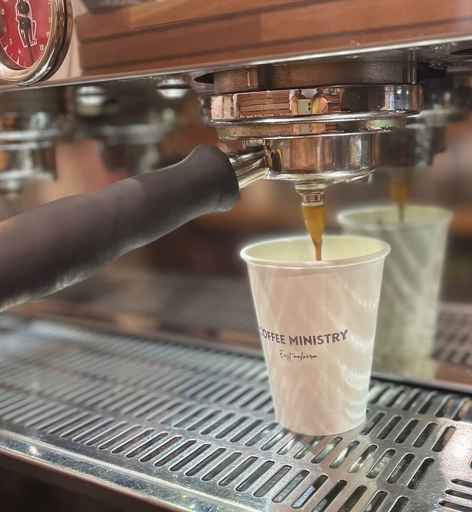 Espresso pouring into a Coffee Ministry cup